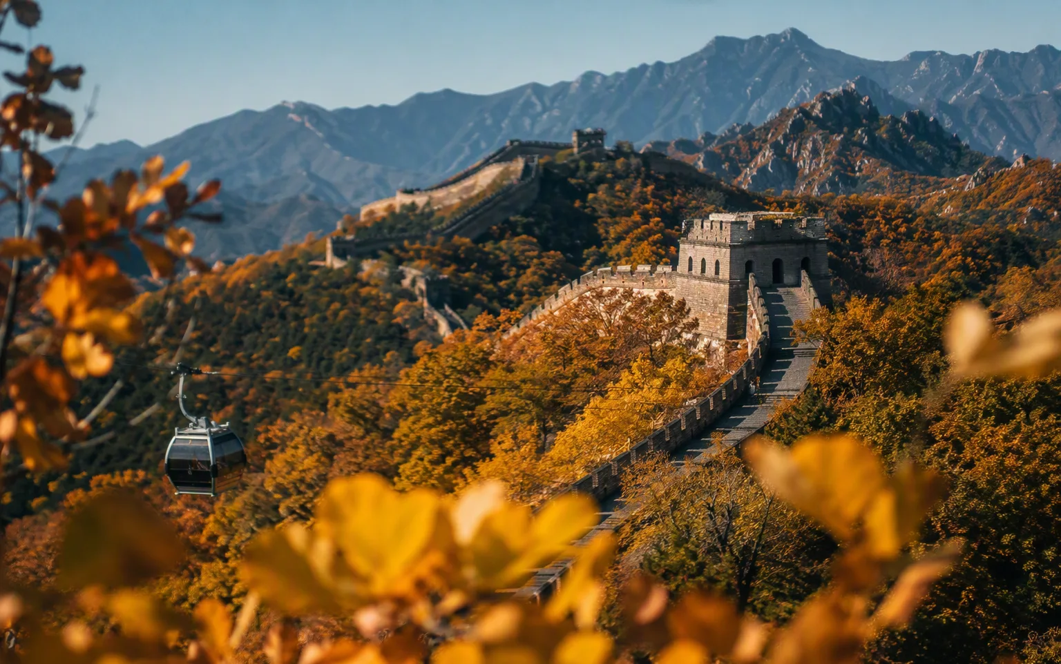 The Great Wall at Mutianyu winding over autumn ridges with a cable car