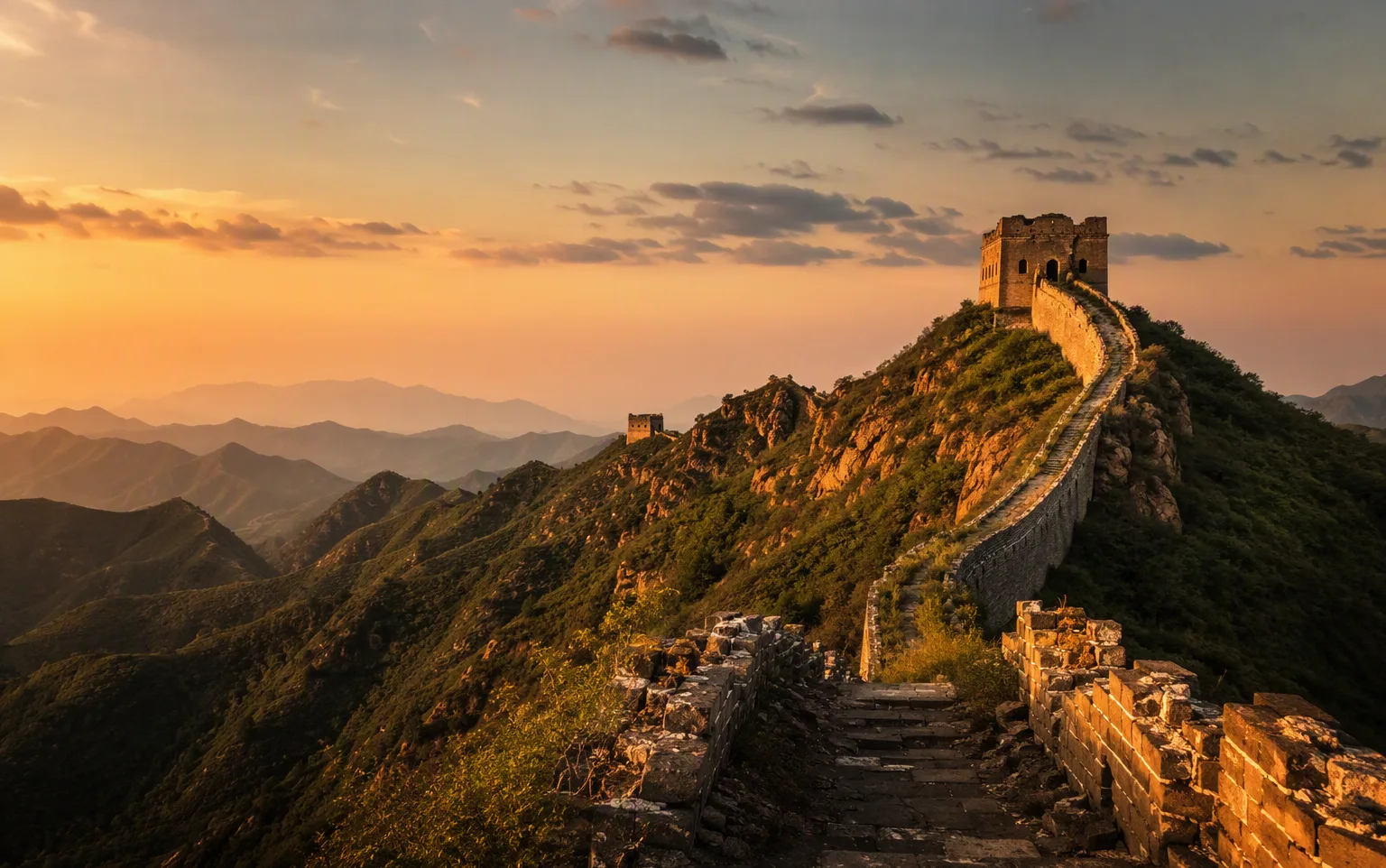Wild unrestored Great Wall sections at Jinshanling in golden sunset light